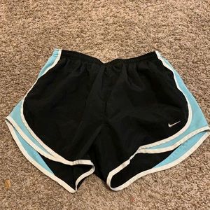 Black and baby blue Nike DriFit running shorts